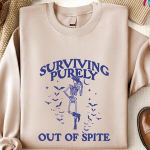Vintage Cowboy Skeleton Hoodie, Surviving Purely out of Spite Tee, Goth Celestial Sweatshirt, Funny Skeleton Lover Shirt, Gothic Boho Shirt