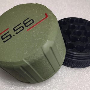 May include: A set of three ceramic mugs with a speckled, matte finish. The mugs are in shades of cream, light gray, and dark gray. Each mug has a simple, minimalist design, perfect for coffee or tea.