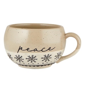 May include: A beige ceramic mug with a rounded shape and a handle. The word "peace" is written in black script. The bottom half features a white band with black snowflake designs and a black border.