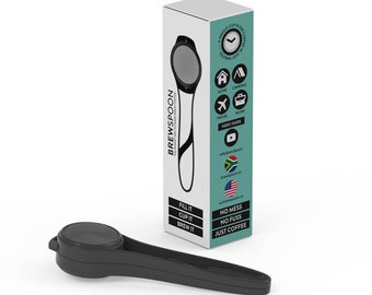 May include: A black coffee filter spoon with a mesh filter and a handle. The packaging shows the product being used at home, camping, travelling, and at work. The packaging also includes the text "BREWSPOON", "FILL IT", "CUP IT", "BREW IT", "NO MESS", "NO FUSS", "JUST COFFEE", and a video guide.