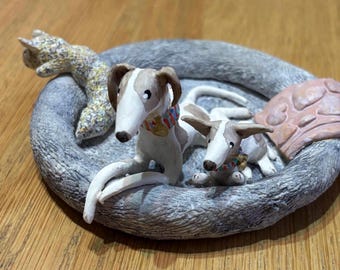 Porcelain whippets on bed sculpture, greyhound, lurcher, podenco, sighthound, Italian Greyhound, Galgo. Unique, handmade & decorated.