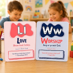 May include: Two educational cards with the words "LOVE" and "WORSHIP" in bold letters. The "LOVE" card has a pink background with the letter "L" and "I" in white. The "WORSHIP" card has a blue background with the letter "W" in white. Both cards have Bible verses.