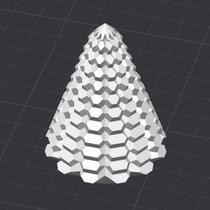 May include: A white, geometric Christmas tree design. The tree is composed of stacked, hexagonal shapes, creating a textured, cone-like form. The background is a dark gray grid.