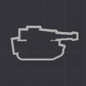 Puede incluir: Un cortador de galletas gris tridimensional con forma de tanque. El tanque tiene un cuerpo rectangular con un cañón largo y cilíndrico que se extiende desde la parte delantera. El diseño está delineado sobre un fondo gris oscuro.