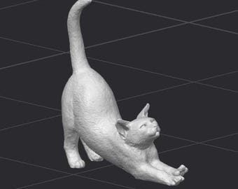 May include: A white ceramic sculpture of a cat stretching. The cat is in a dynamic pose with its tail raised high in the air and its front paws extended forward.