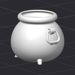 May include: A white ceramic cauldron with a handle on the side. The cauldron has three short legs and a rounded body.