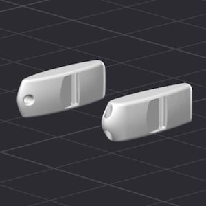 May include: Two white, oblong-shaped objects with a rounded end and a hole. Each object has a rectangular cutout and a groove. The objects are set against a dark, grid-patterned background.