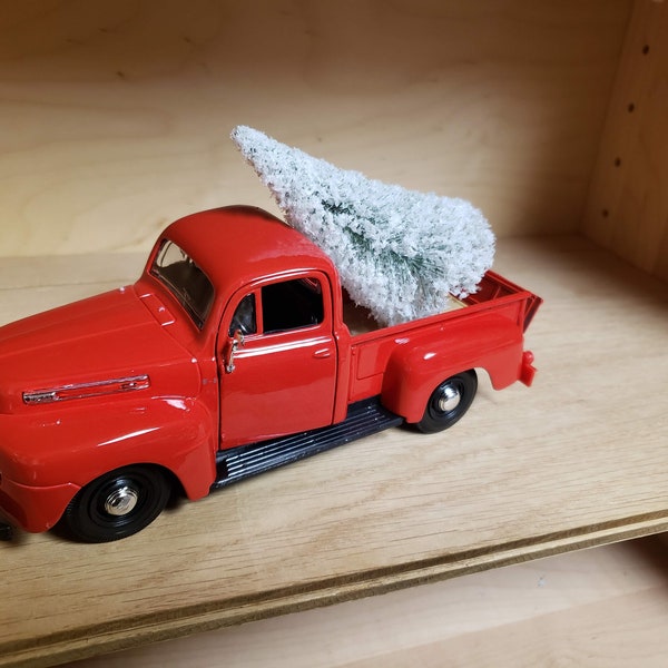 Old red truck; retro 1948 Ford F1 in red; Christmas decor