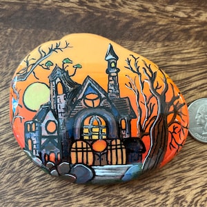Halloween haunted house painted rock
