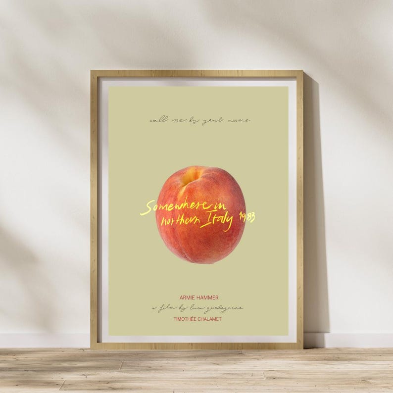 May include: A poster with a peach on a light green background. The text on the poster reads "call me by your name", "Somewhere in northern Italy 1983", "Armie Hammer", "a film by Luca Guadagnino", and "Timoth&eacute;e Chalamet".