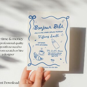 May include: A printable baby shower invitation with a blue and white design. The invitation says "Bonjour B&eacute;b&eacute;" and includes the text "Join us for a baby shower honouring Tiffany Smith. Saturday, 23rd November. The Smith's House, The Smith's House, 123 Anywhere St., Any City."