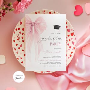 May include: A graduation party invitation with a pink bow design. The invitation includes the text "Join us for a graduation party" and details such as the honoree's name, date, time, and location. The invitation is on a plate decorated with hearts.