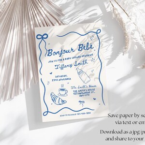May include: A blue and white baby shower invitation with the text "Bonjour B&eacute;b&eacute;" and "Tiffany Smith". The invitation includes details for the event, including the date, time, and location.