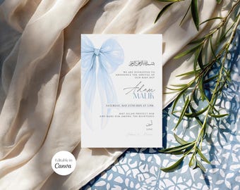 May include: A baby announcement card with a light blue bow and text. The card says "We are overjoyed to announce the arrival of our baby boy, Adam Malik." The date and time are also included.