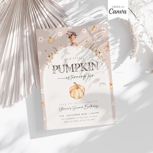 May include: A beige invitation card with the text "Our Little Pumpkin is turning two." The card features a watercolor illustration of a pumpkin and a girl. The text "Editable on Canva" is in the upper right corner.