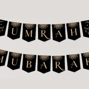 May include: Black and gold banner with the words "Eid Mubarak" in a decorative font. Each letter is on a separate flag with a gold mandala design.