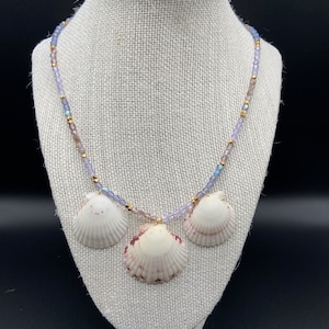 Natural Seashell Beaded Necklace. Purple and gold beaded necklace with three Atlantic calico shells found on Sanibel Island, Florida