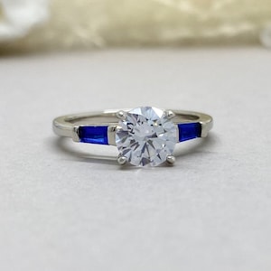 Round Simulated Diamond Three Stone Blue Sapphire Engagement Ring Art Deco 1.50Ct Round Sterling Silver Bridal Engagement Ring