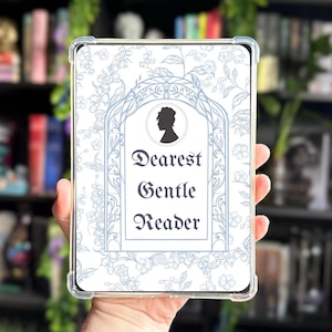 May include: A clear protective case for an e-reader with a white and blue floral design. The case features the text "Dearest Gentle Reader" in elegant script, along with a silhouette of a person. The case is designed to fit a tablet.