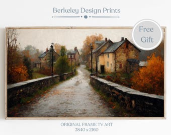 May include: An autumnal landscape painting featuring a stone bridge over a wet road, leading to a village with buildings. The artwork has a vintage aesthetic, with the text "Berkeley Design Prints" at the top and "Original Frame TV Art" at the bottom.