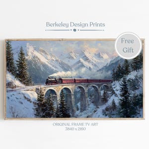 May include: A framed print of a vintage train crossing a stone bridge in a snowy mountain landscape. The print has a wooden frame and features the text "Berkeley Design Prints" and "Original Frame TV Art 3840 x 2160".