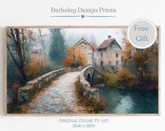 May include: A framed print of a landscape painting featuring a stone bridge over a river, with buildings and trees in the background. The artwork has a muted color palette with autumn hues. Text on the print reads "Berkeley Design Prints" and "Original Frame TV Art 3840 x 2160".