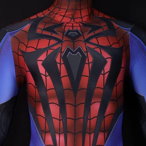 May include: A red and black Spider-Man costume with a web pattern design. The costume features blue accents on the arms and shoulders. The chest area has a large black spider emblem.