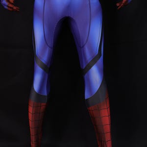 May include: A blue and red superhero costume with a web pattern on the lower legs and feet. The costume has a blue torso with black accents and red gloves. The overall design is a close-fitting, full-body suit.