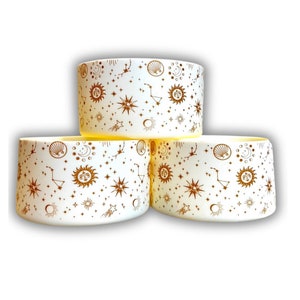 May include: Three white ceramic bowls with a gold celestial pattern. The pattern includes stars, moons, suns, and constellations.