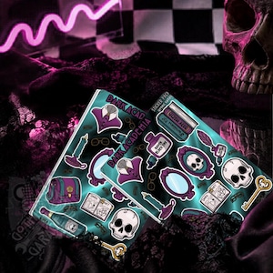 May include: Two sticker sheets with a teal background and various gothic-themed illustrations. The stickers include skulls, keys, candles, and the text "Dark Academia". The stickers are in purple, teal, and white.