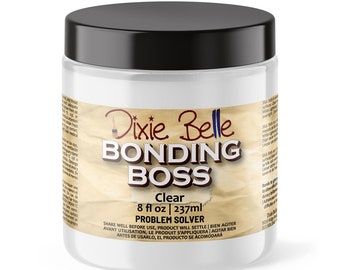 May include: A clear glass jar with a black lid containing Dixie Belle Bonding Boss Clear Problem Solver. The jar is labeled with the product name, size (8 fl oz / 237 ml), and instructions to shake well before use.