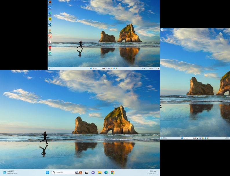 May include: A computer desktop with a blue sky and white clouds as the background. The desktop shows a person running on a beach with a large rock formation in the background. The water is reflecting the sky and clouds.