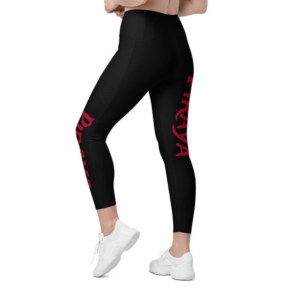 Black leggings with pockets with Red Piraya print on front left leg and back of right leg