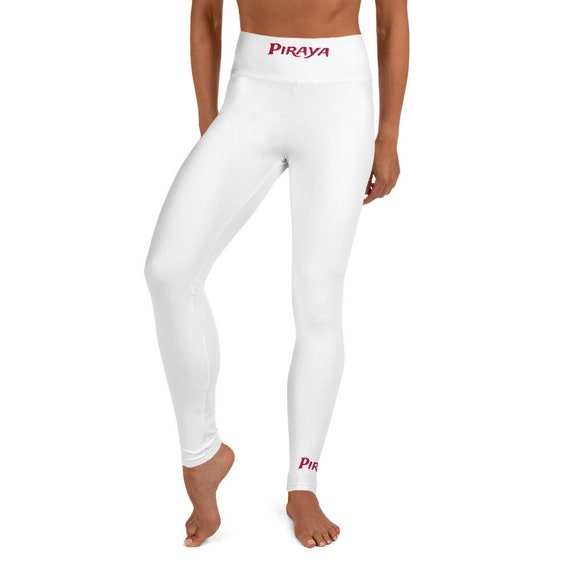 White Yoga Leggings with red Piraya print on front waistband and bottom of left leg