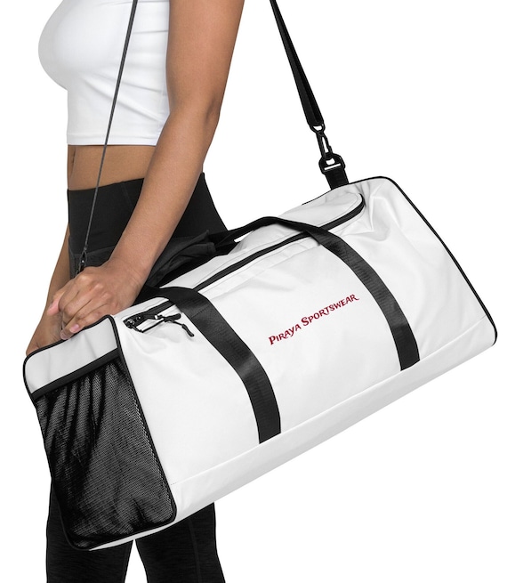 Piraya Sportswear duffle Bag. a large, cylindrical bag, for carrying personal belongings, great for gym or traveling.