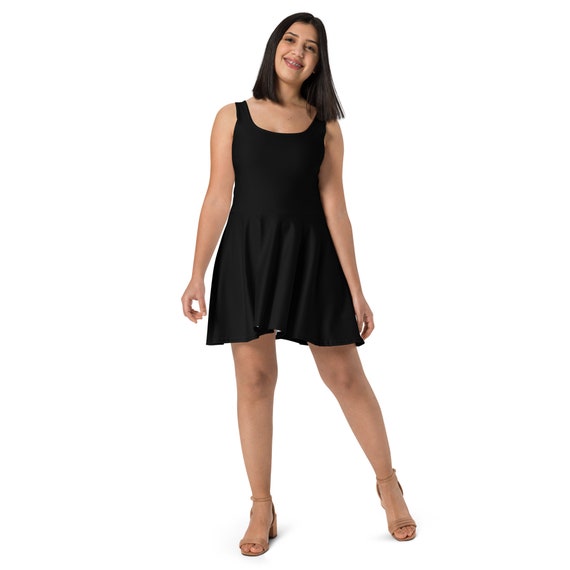 Black Skater Dress, a short dress with a fitted waist and a skirt that flares into an A-line shape.