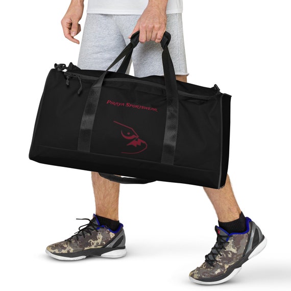 Black Duffle bag with Piraya Sportswear Logo printed in red on the front and back