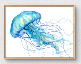 May include: Watercolor painting of a blue jellyfish with long, flowing tentacles. The jellyfish has a translucent appearance with shades of blue and yellow. The artwork is framed in a light brown wooden frame, set against a white background.