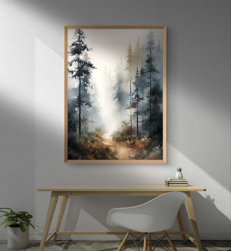 May include: A watercolor painting of a forest path with tall trees on either side. The path leads into the distance, where the trees are obscured by fog. The painting is framed in a light wood frame.