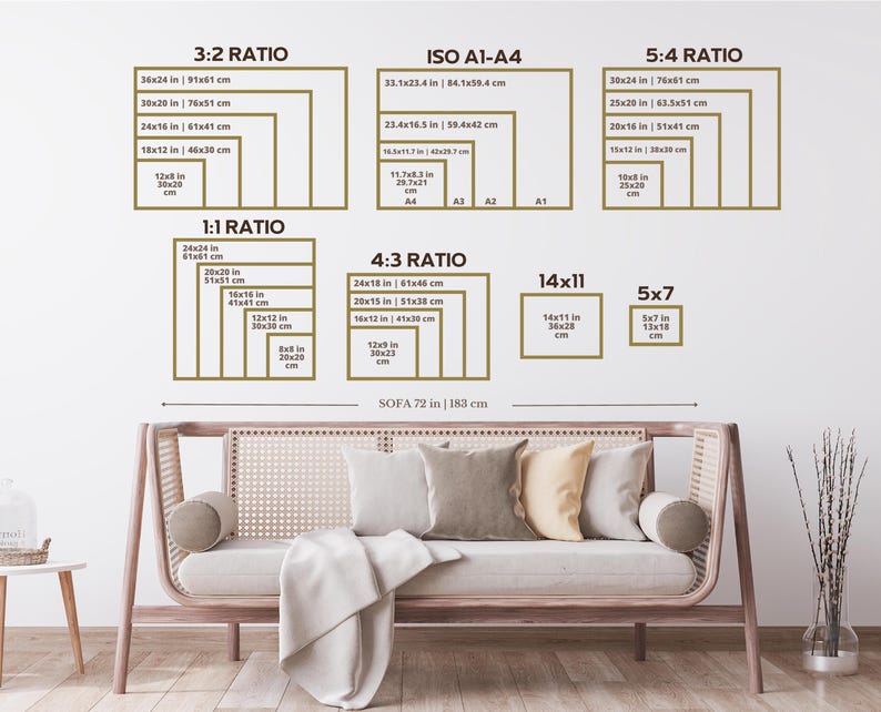 May include: A wall display showing various print sizes and aspect ratios, including 3:2, ISO A1-A4, 5:4, 1:1, 4:3, 14x11, and 5x7. The sizes are listed in inches and centimeters. A sofa with pillows and a blanket is in the foreground.