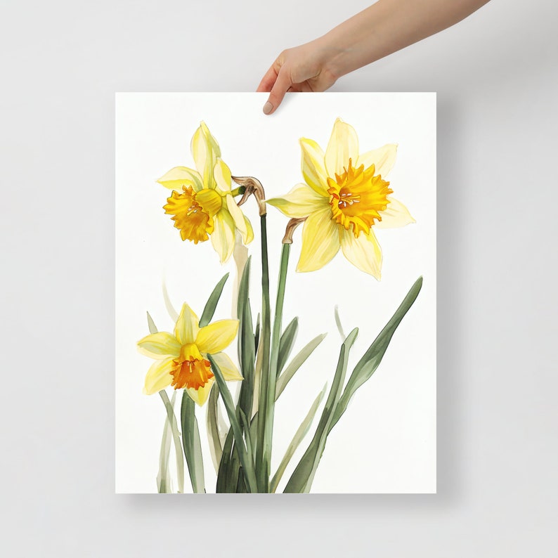 May include: A watercolor painting of three yellow daffodils with orange centers. The flowers are arranged in a bouquet with green stems and leaves.
