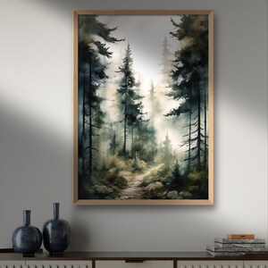 May include: A framed watercolor painting of a forest path leading into a misty, green forest. The path is lined with tall, dark green trees and the light is soft and diffused.