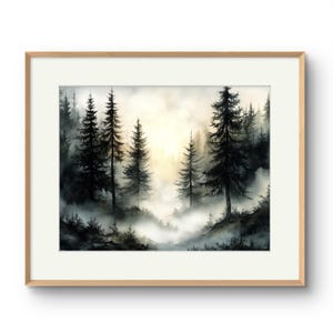 May include: Watercolor painting of a misty forest scene. Tall, dark evergreen trees are silhouetted against a soft, golden light. The artwork is framed in a light wood frame with a white mat, creating a serene and natural aesthetic.