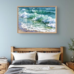 May include: A rectangular framed wall art print featuring a painting of ocean waves crashing onto a sandy shore. The artwork displays shades of deep blue, turquoise, and emerald green water with white sea foam cresting across the surface.