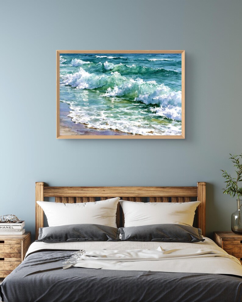 May include: A rectangular framed wall art print featuring a painting of ocean waves crashing onto a sandy shore. The artwork displays shades of deep blue, turquoise, and emerald green water with white sea foam cresting across the surface.