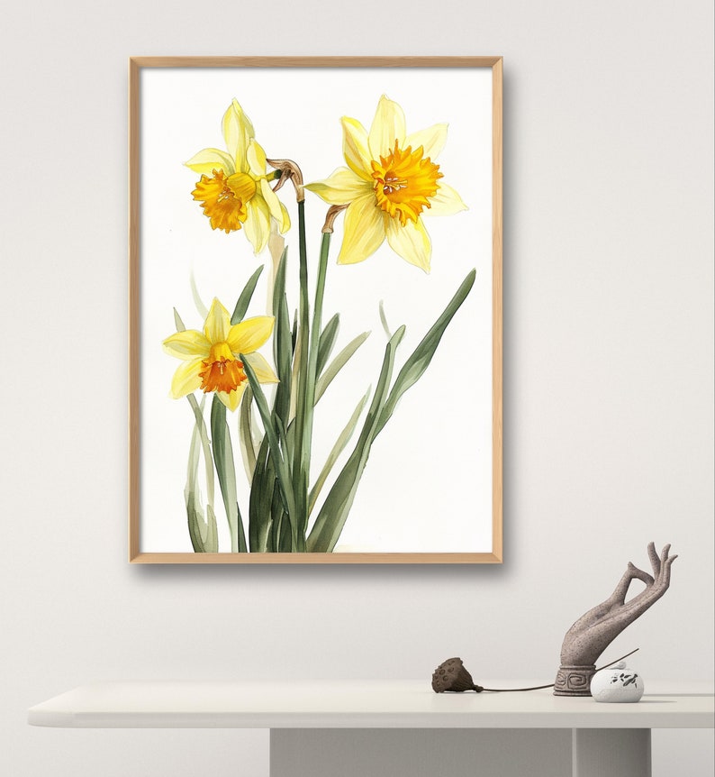 May include: A watercolor painting of three yellow daffodils with orange centers. The flowers are arranged in a bouquet with green leaves on a white background.