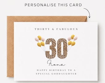 May include: A white birthday card with a brown kraft envelope. The card features the text "THIRTY & FABULOUS", the number "30" in a leopard print pattern, the name "Fiona", and "HAPPY BIRTHDAY TO A SPECIAL GODDAUGHTER" with gold and pink balloons.