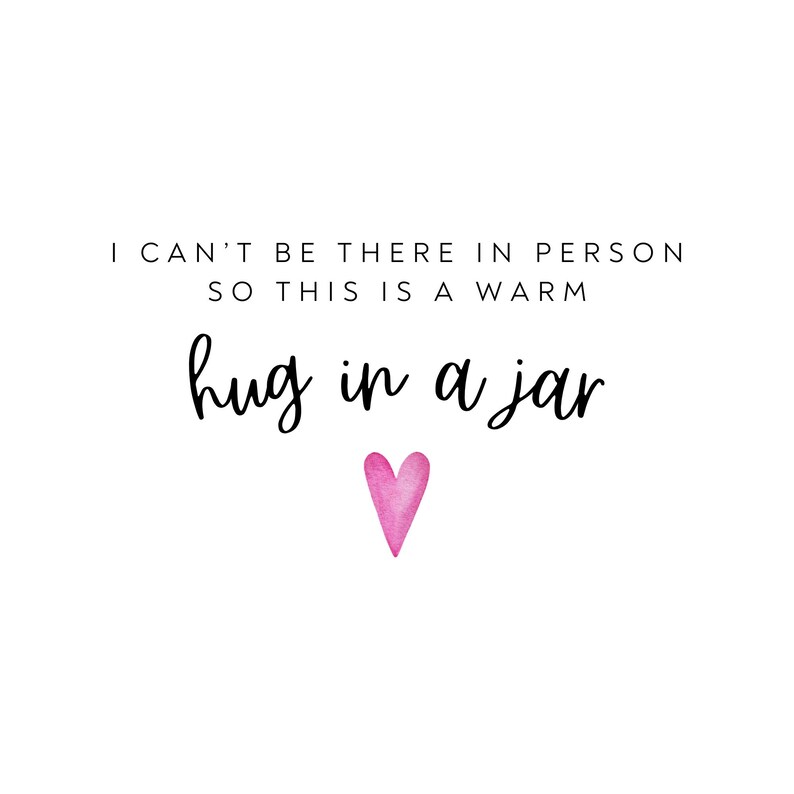 May include: A white background with black text that reads "I can't be there in person so this is a warm hug in a jar" with a pink heart below the text.