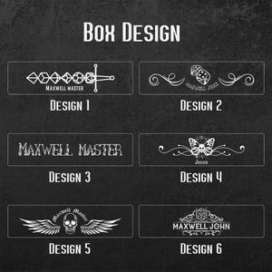 May include: Six different box designs with various graphics and text. The designs include a sword, dice, butterfly, skull with wings, and a stylized dice. The text includes "Maxwell Master", "Maxwell John", "Jessie", and "Maxwell John".
