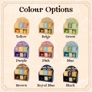 May include: A display of nine miniature bookshelf calendars in various colors, including yellow, beige, green, purple, pink, blue, brown, royal blue, and black. Each calendar displays "Books Read This Year" and the number "077". The text "Colour Options" is at the top.